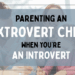 A mother and father drawing pictures with their two daughters with the title 'Parenting an Extrovert Child When You’re an Introvert' overlaid.